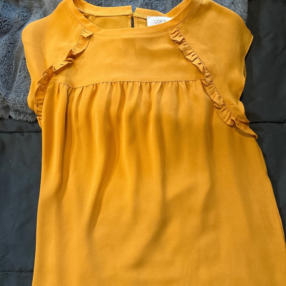 Gold blouse with ruffle detail